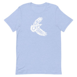 Heather blue (sky blue) short sleeve shirt with white crow silhouette filled with the words "Call of the Crow Quartet."