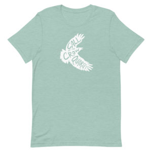 Heather prism dusty blue (seafoam green) short sleeve shirt with white crow silhouette filled with the words "Call of the Crow Quartet."