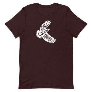 Oxblood black short sleeve shirt with white crow silhouette filled with the words "Call of the Crow Quartet."