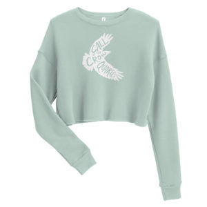 Dusty blue (seafoam green) cropped sweatshirt with white crow silhouette filled with the words "Call of the Crow Quartet."